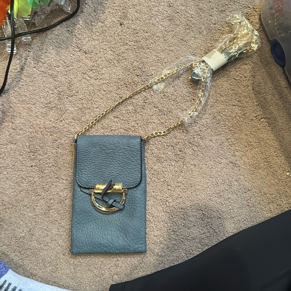 unknown brand? but brand new, adjustable strap, can go over the shoulder
